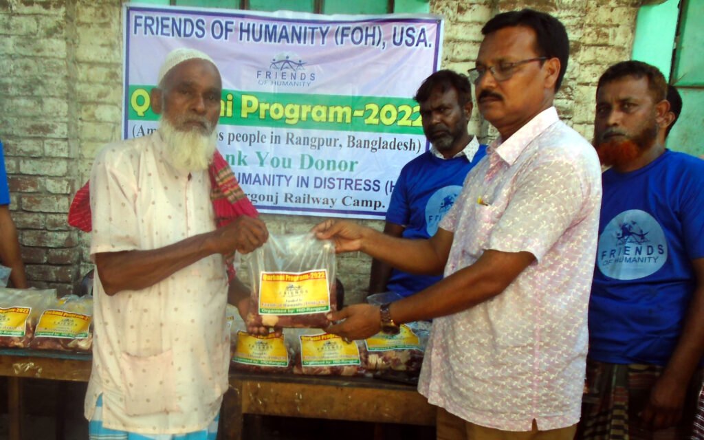 Meat is distributed among the Badarganj Railway Camp through animal sacrifice.