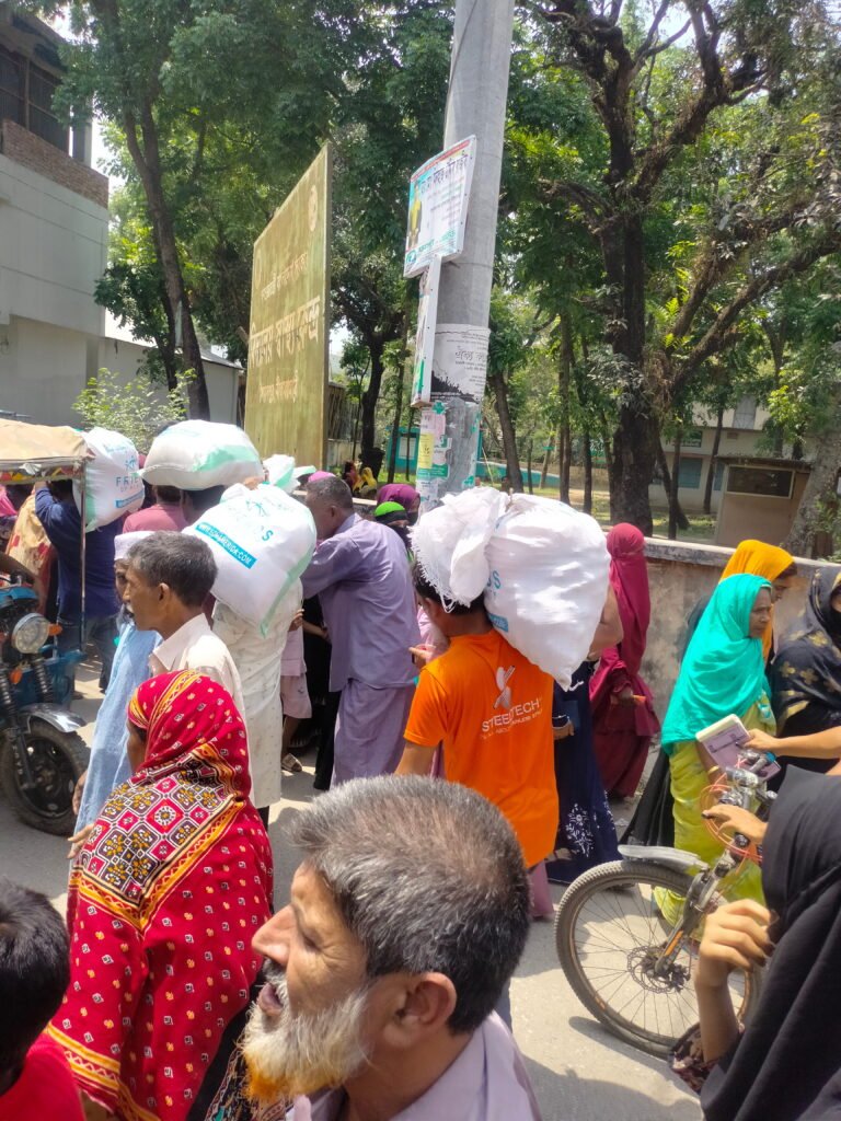 Poor & Distress People with Ramadan Food Package in Saidpur