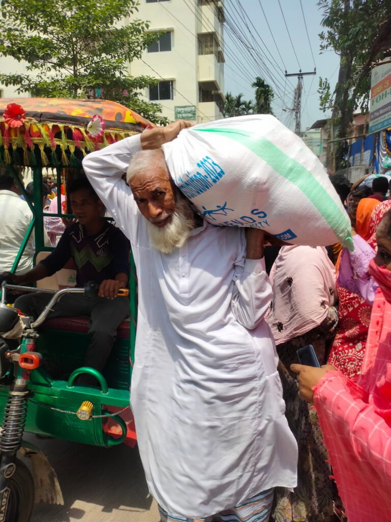 Poor & Distress People with Ramadan Food Package in Saidpur