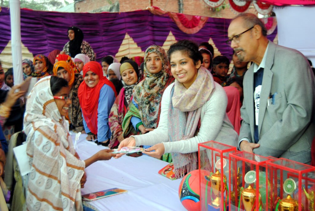Student receives gift for the Annual Sports Program from Juveria Ahmad.