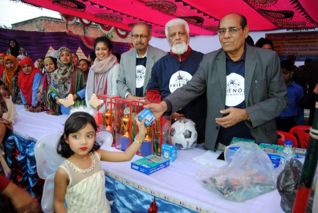Student receives gift for the Annual Sports Program from Syed Jalaluddin Ahmad (Jalal Azimabadi)